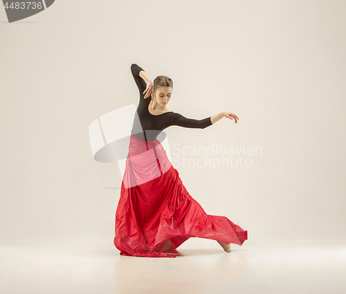 Image of Modern ballet dancer dancing in full body on white studio background.