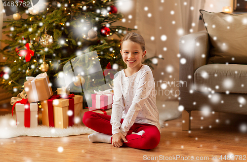 Image of smiling girl at christmas home