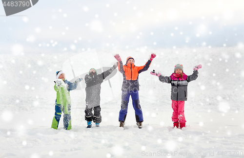 Image of happy little kids playing outdoors in winter