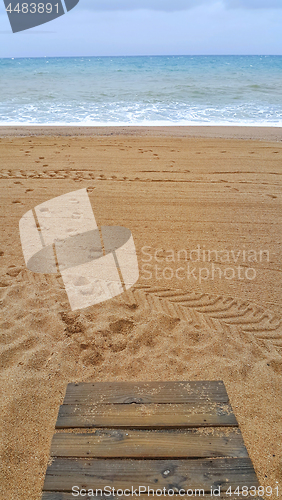 Image of A deserted beach on an overcast rainy day