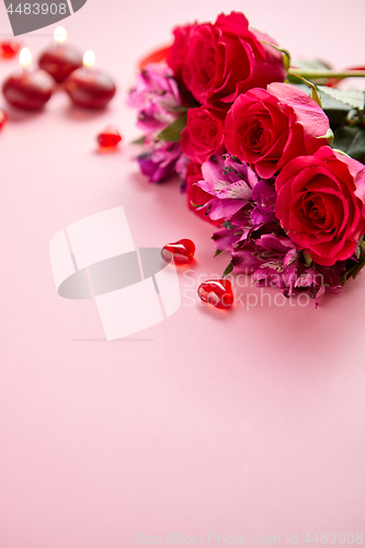 Image of Mixed flowers bouquet with roses, candles and heart shaped acrylic decorations