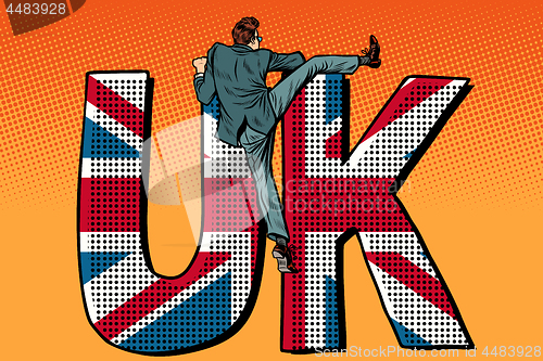 Image of businessman overcomes the border. UK word flag