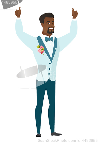 Image of Groom standing with raised arms up.