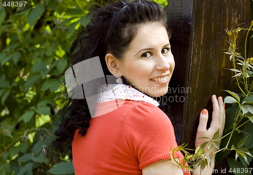Image of smiling woman in red