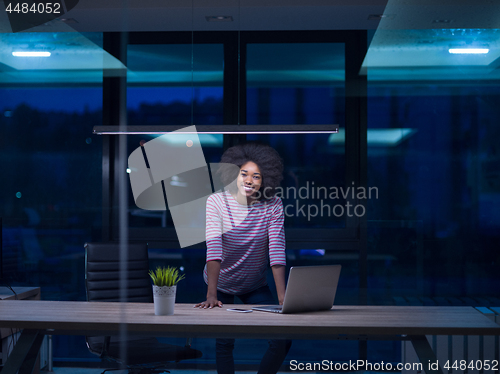 Image of black businesswoman using a laptop in startup office