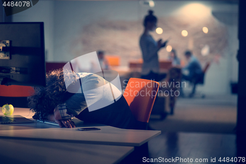 Image of businessman relaxing at the desk