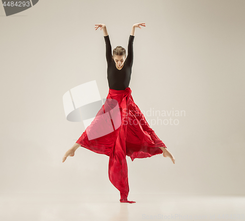 Image of Modern ballet dancer dancing in full body on white studio background.