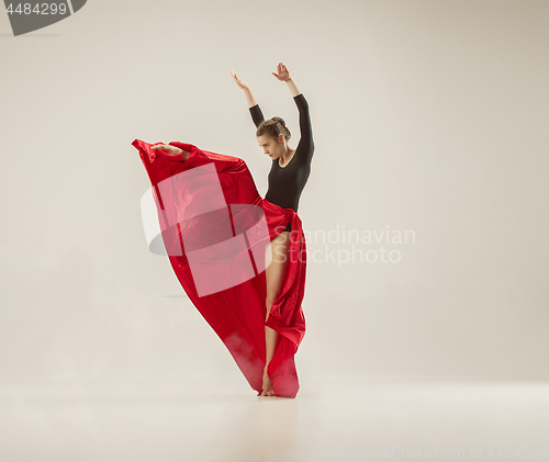 Image of Modern ballet dancer dancing in full body on white studio background.