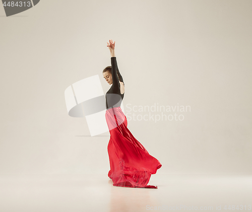 Image of Modern ballet dancer dancing in full body on white studio background.