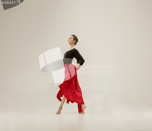 Image of Modern ballet dancer dancing in full body on white studio background.