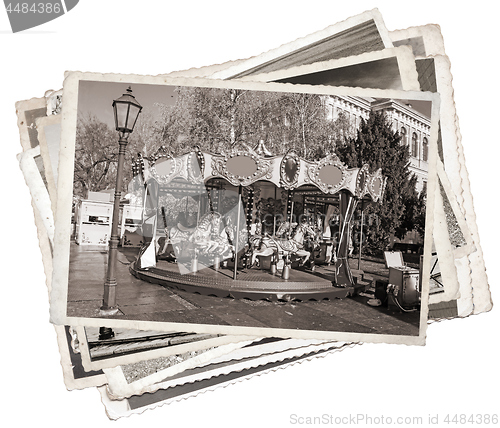 Image of Old fashioned french carousel with horses Stack of old photos 