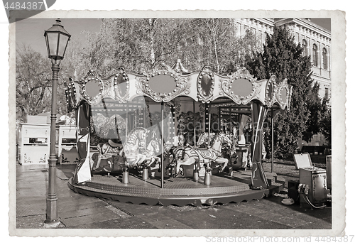 Image of Old fashioned french carousel with horses Vintage Monochrome pho