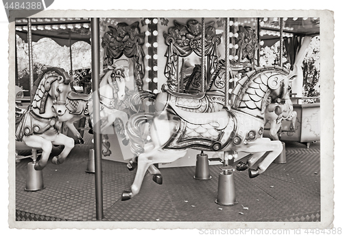 Image of Old fashioned french carousel with horses Vintage Monochrome pho