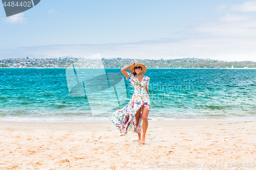 Image of Female walking along a secluded beach in Sydney Harbour