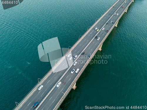 Image of Vehicles on bridge over water