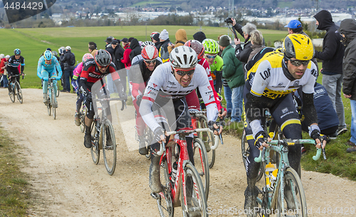 Image of The Peloton on a Dirty Road - Paris-Nice 2016