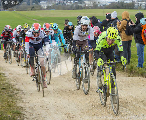 Image of The Peloton on a Dirty Road - Paris-Nice 2016