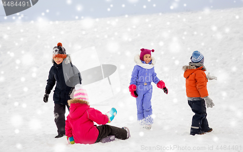 Image of happy little kids playing outdoors in winter