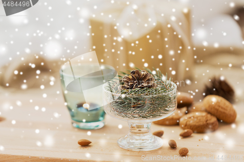 Image of christmas fir decoration with cone in dessert bowl