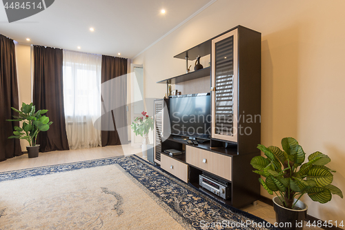 Image of The interior of a spacious living room in the apartment