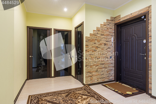 Image of Spacious entrance hall in the apartment, three doors to the room, bathroom and toilet