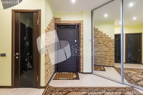 Image of Spacious entrance hall in the apartment with built-in wardrobe and mirrors