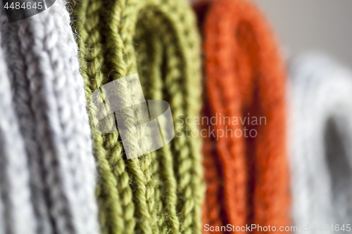 Image of Orange, green and grey wool knitted texture