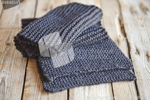 Image of knitted dark grey scarf 
