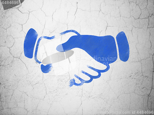 Image of Politics concept: Handshake on wall background