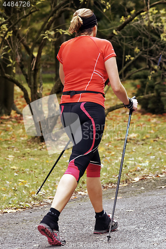 Image of Woman in the park - Nordic walking