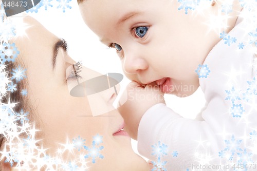 Image of happy mother playing with baby boy