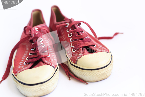 Image of Old sneakers on a white background