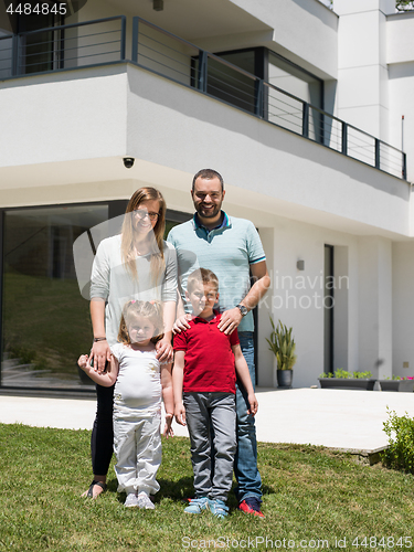 Image of happy family with children in the yard