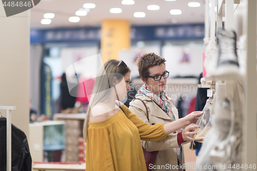 Image of best friend shopping in big mall