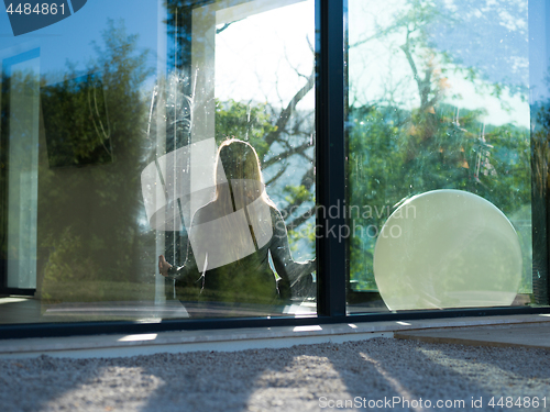 Image of young woman doing morning yoga exercises