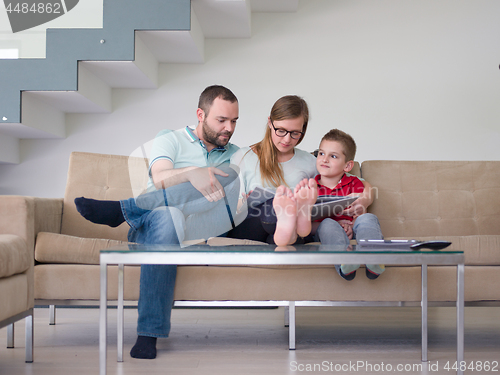 Image of family with little boy enjoys in the modern living room