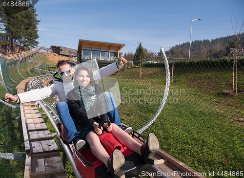 Image of couple enjoys driving on alpine coaster