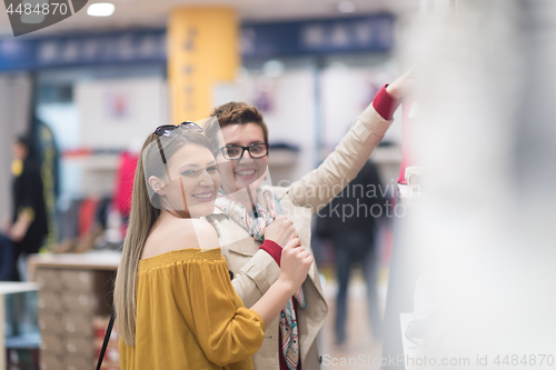Image of best friend shopping in big mall