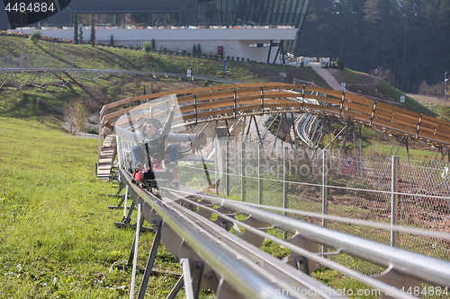 Image of couple enjoys driving on alpine coaster