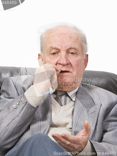 Image of Senior man taking medication