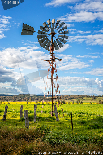 Image of Southern Cross windmill in a rural field with crops