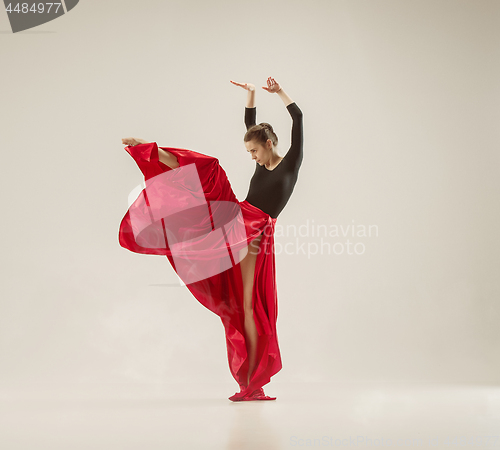 Image of Modern ballet dancer dancing in full body on white studio background.