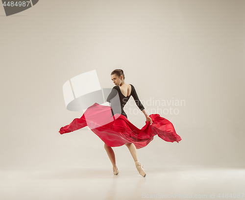 Image of Modern ballet dancer dancing in full body on white studio background.