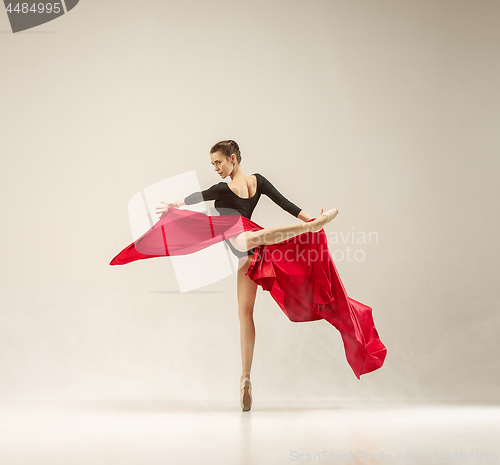 Image of Modern ballet dancer dancing in full body on white studio background.