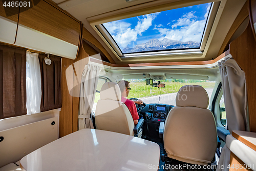 Image of Man driving on a road in the Camper Van RV