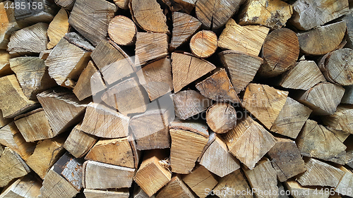 Image of Firewood pile stacked chopped wood trunks