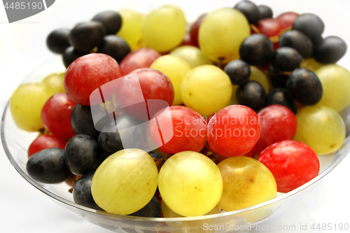 Image of Bright assortment tasty ripe grapes in a glass plate