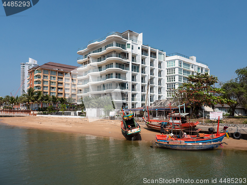 Image of Luxury condos and fishing boats in Pattaya, Thailand