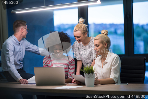 Image of Multiethnic startup business team in night office