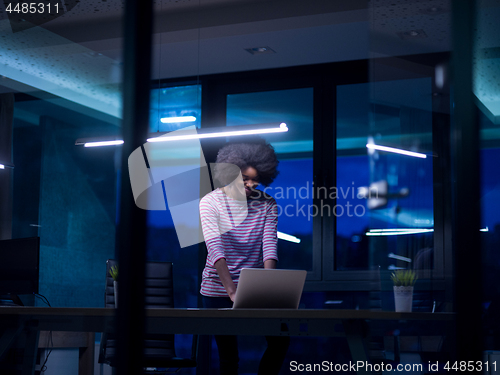 Image of black businesswoman using a laptop in startup office